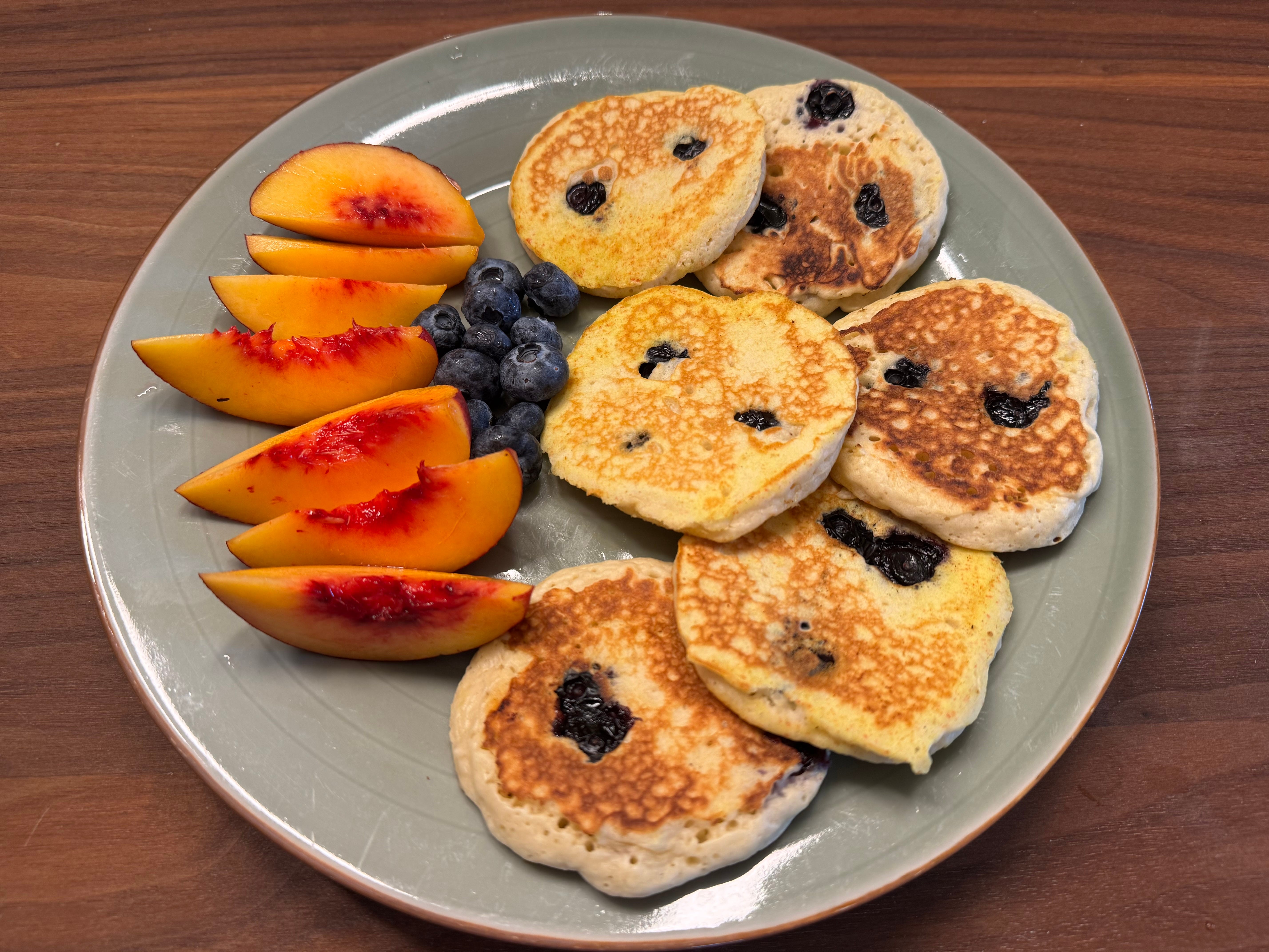 Blueberry pancakes and fruit.