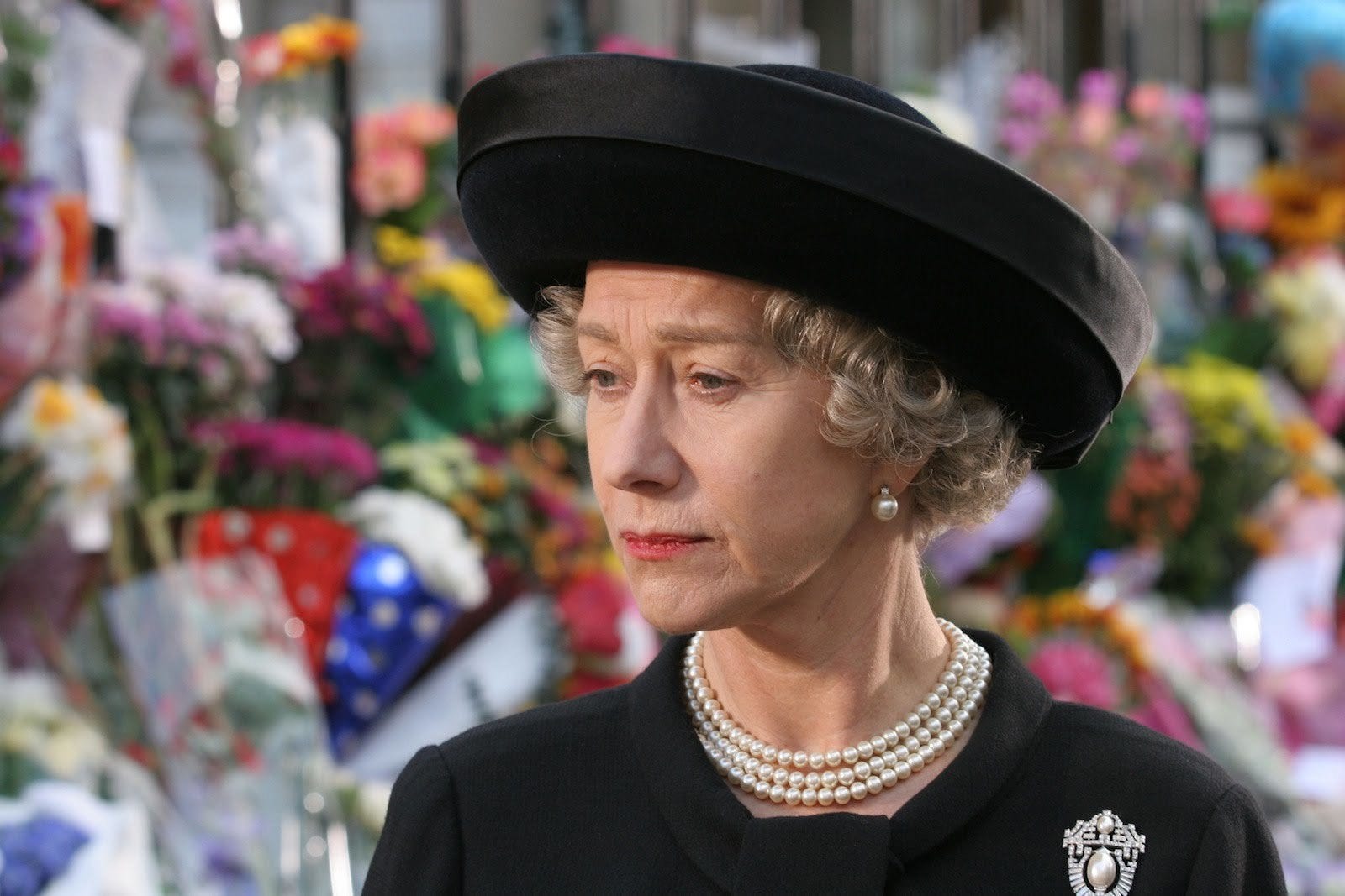 Helen Mirren as the Queen of England dressed in all black