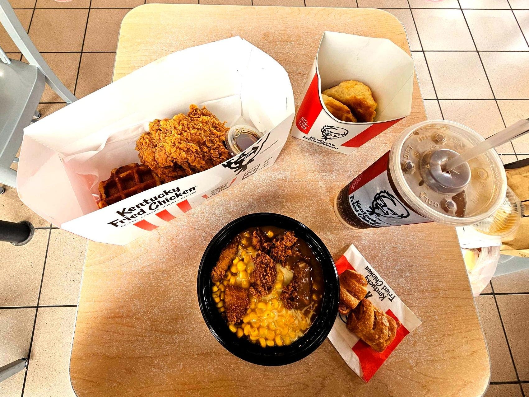 A top-down view of a KFC meal on a small table.