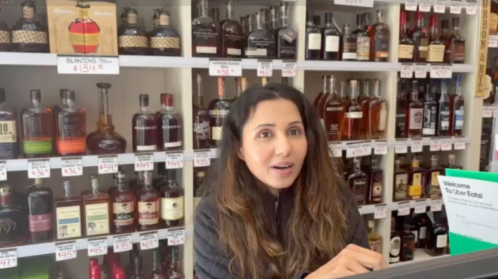 Video grab of Indu Bhatia in her liquor store in Washington, DC.