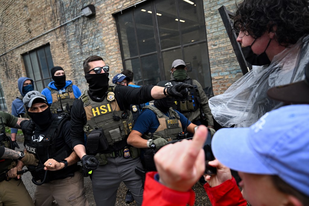 Federal agents clash with activists in Chicago.