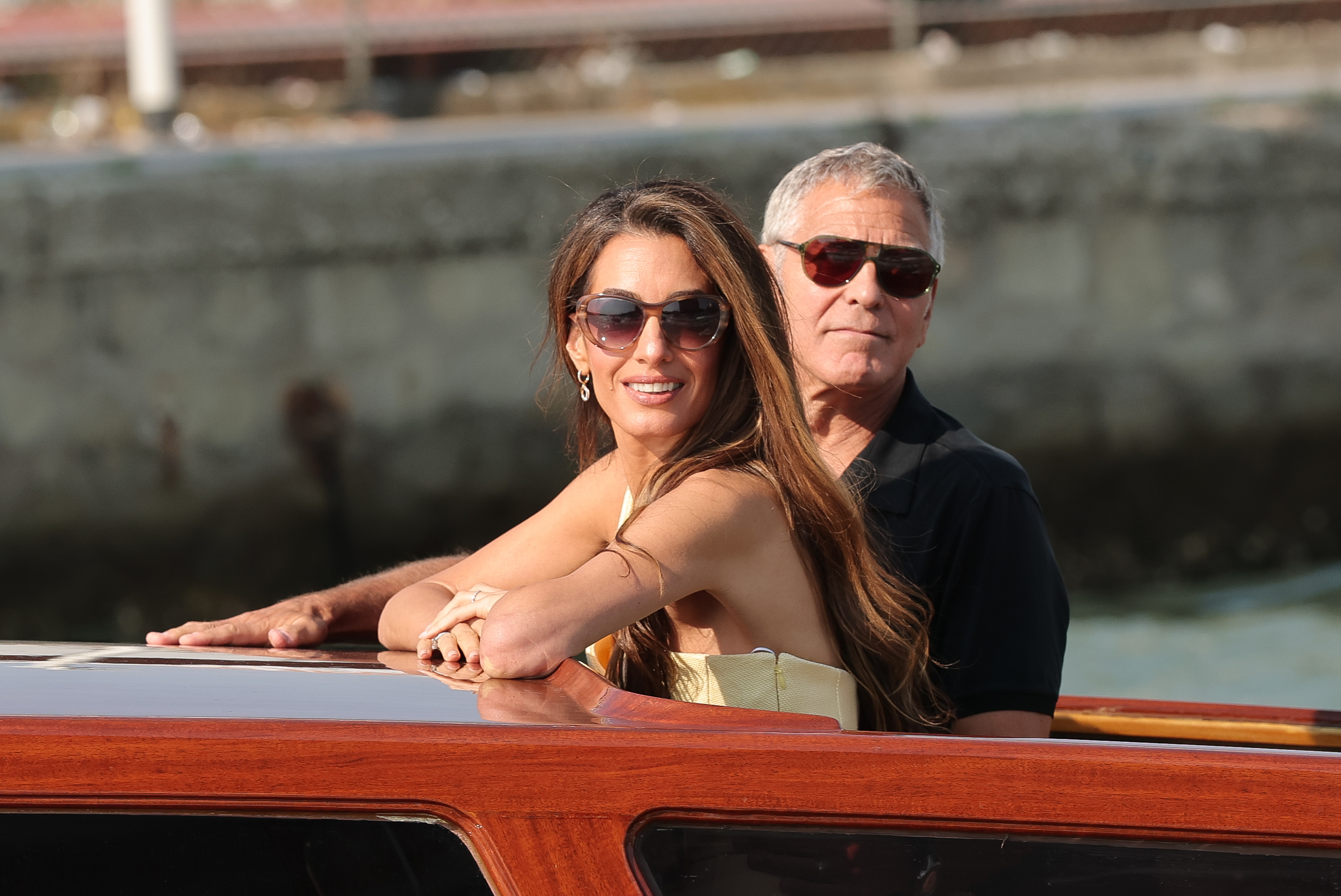 Amal Clooney and George Clooney arrive in Venice via boat for the Venice Film Festival.