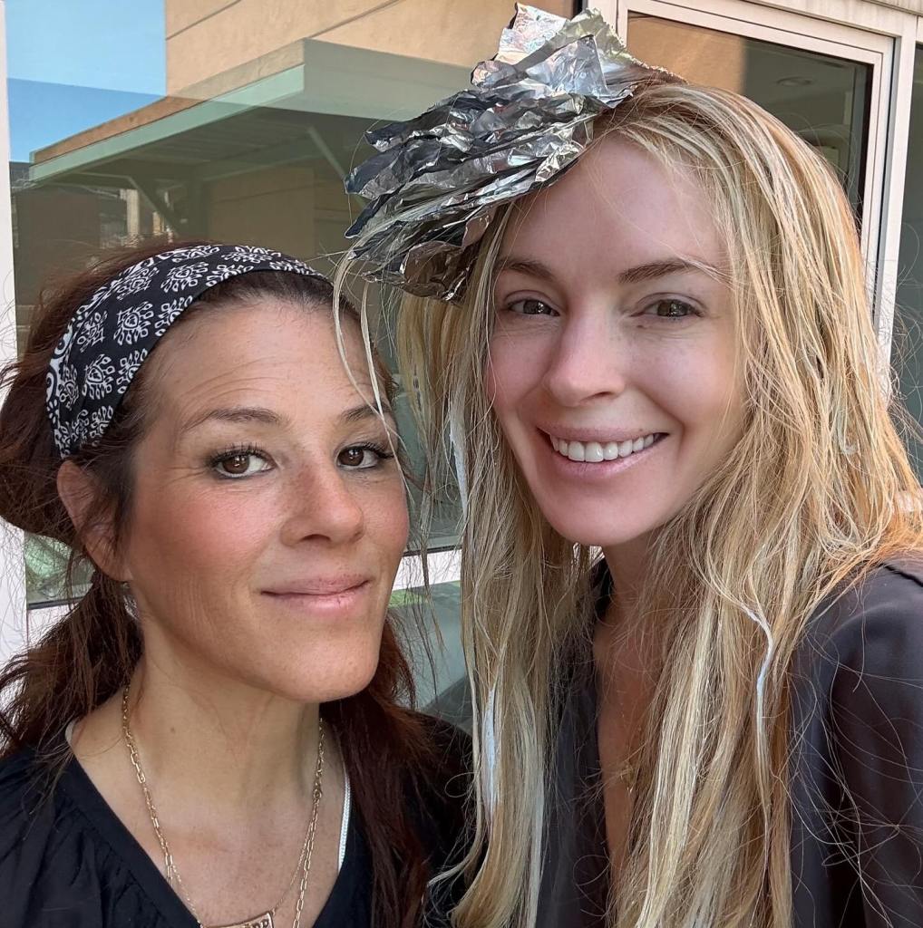 Lindsay Lohan shares a bare-faced selfie with hair stylist Tracey Cunningham.