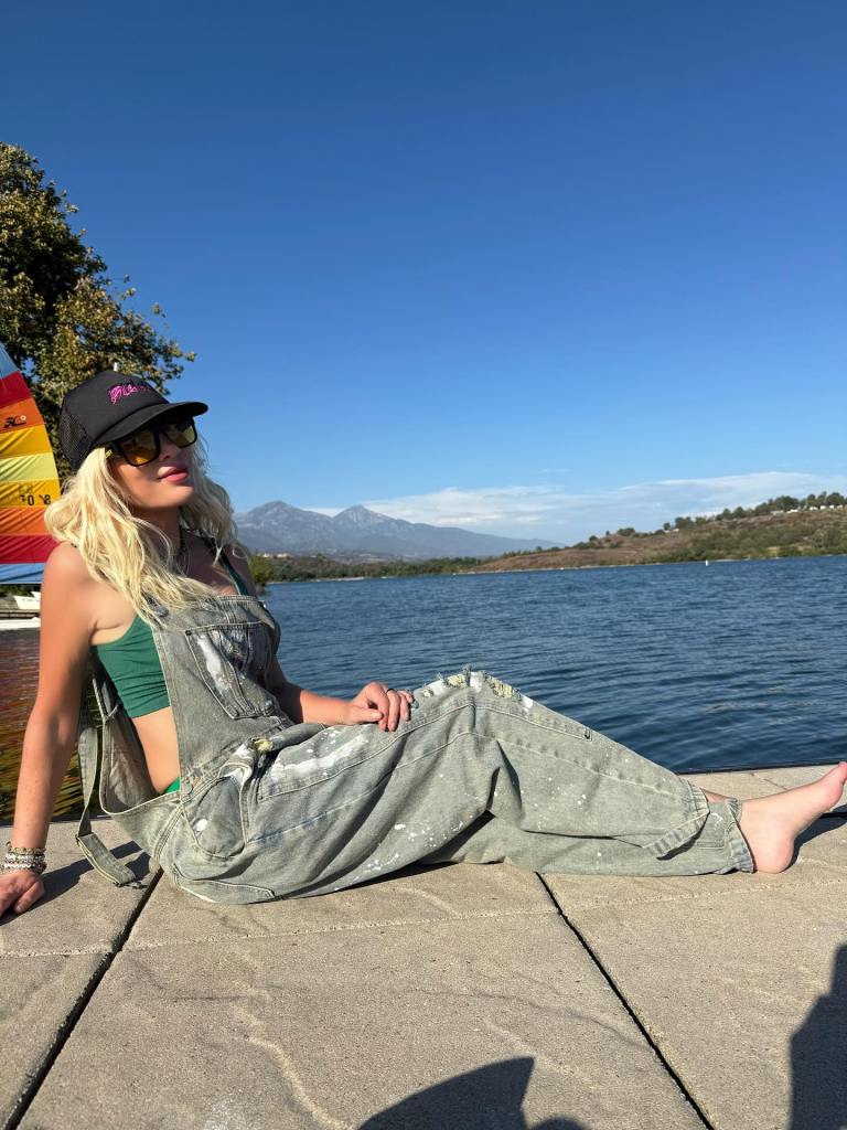 Tori Spelling lounges while on a fishing trip with her family.