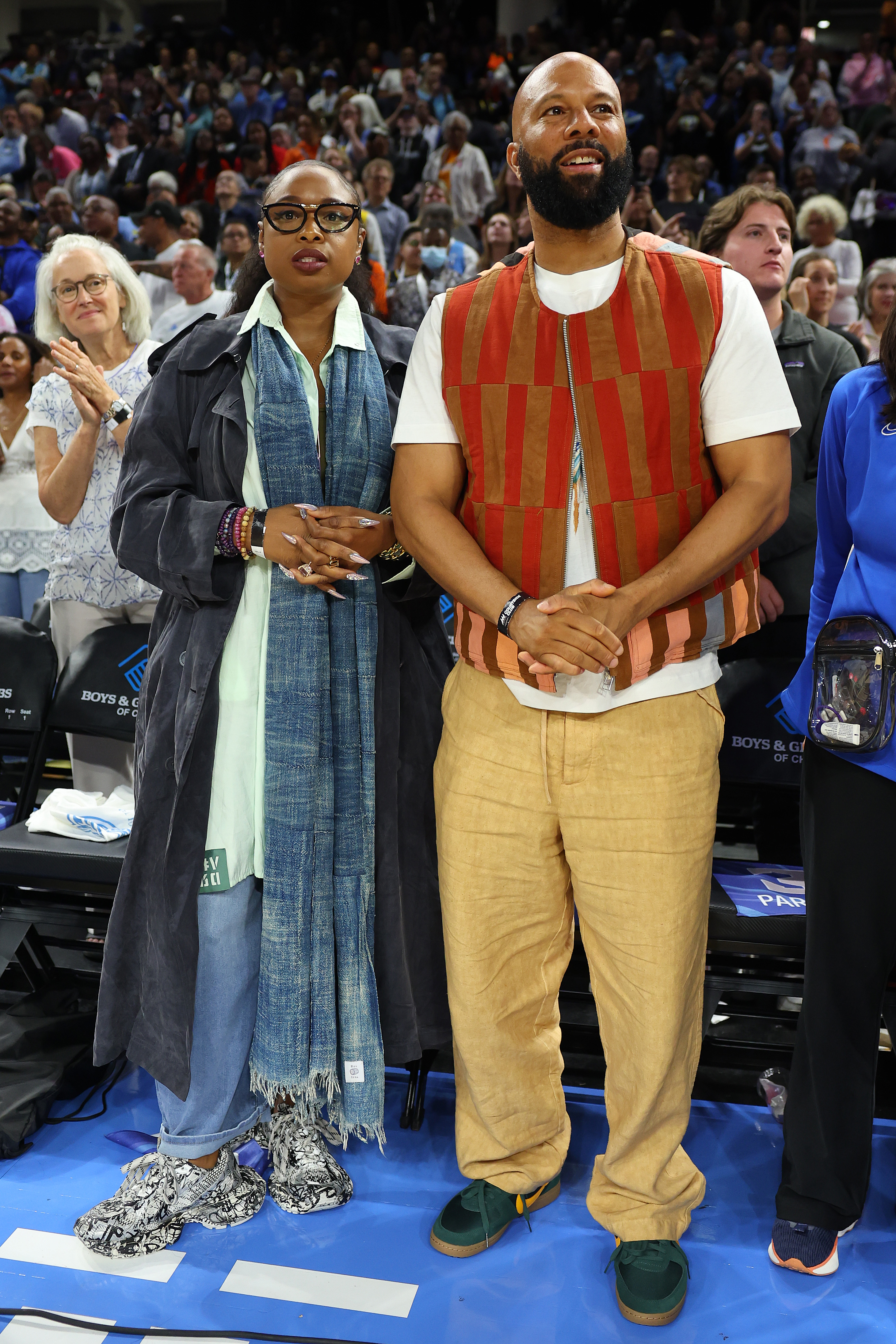 Jennifer Hudson and Common attend former Chicago Sky player Candace Parker's jersey retirement ceremony during the first half at Wintrust Arena in Chicago, Illinois. 
