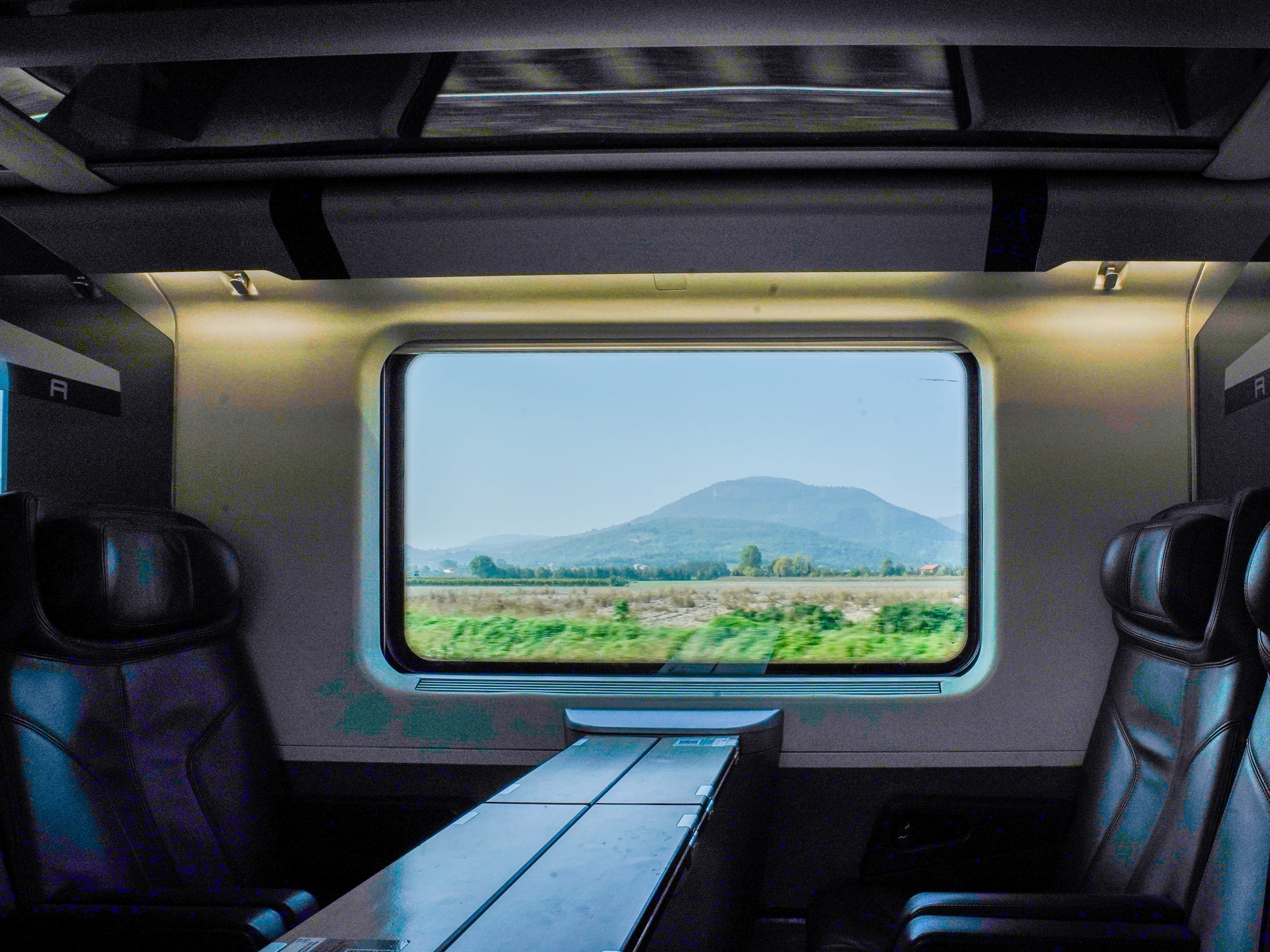Business-class seating on a train from Venice to Rome.