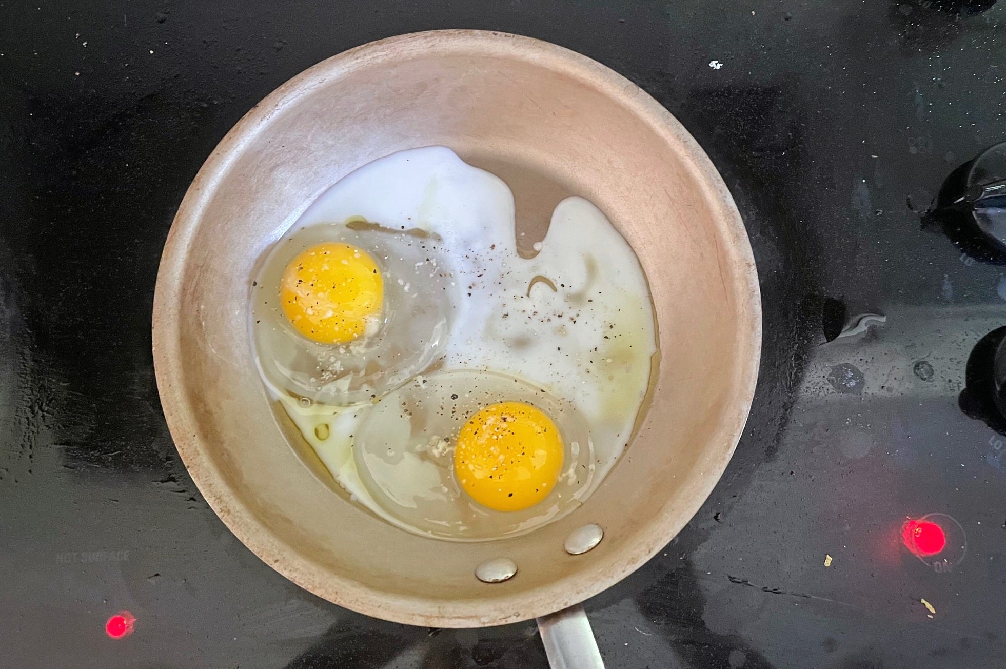Eggs in pan for Gordon Ramsay fried eggs