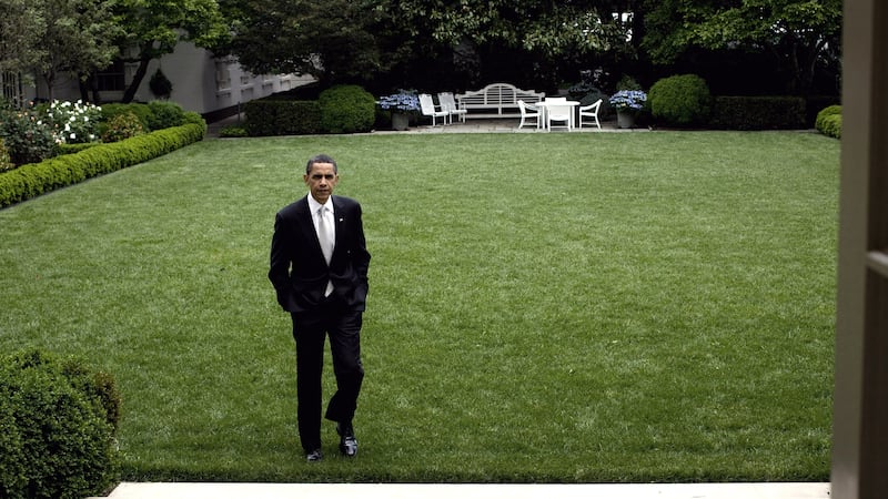 President Barack Obama walks in the White House Rose Garden, May 15, 2009.