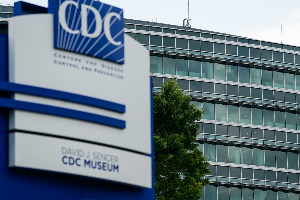 CDC building with bullet holes in the windows.
