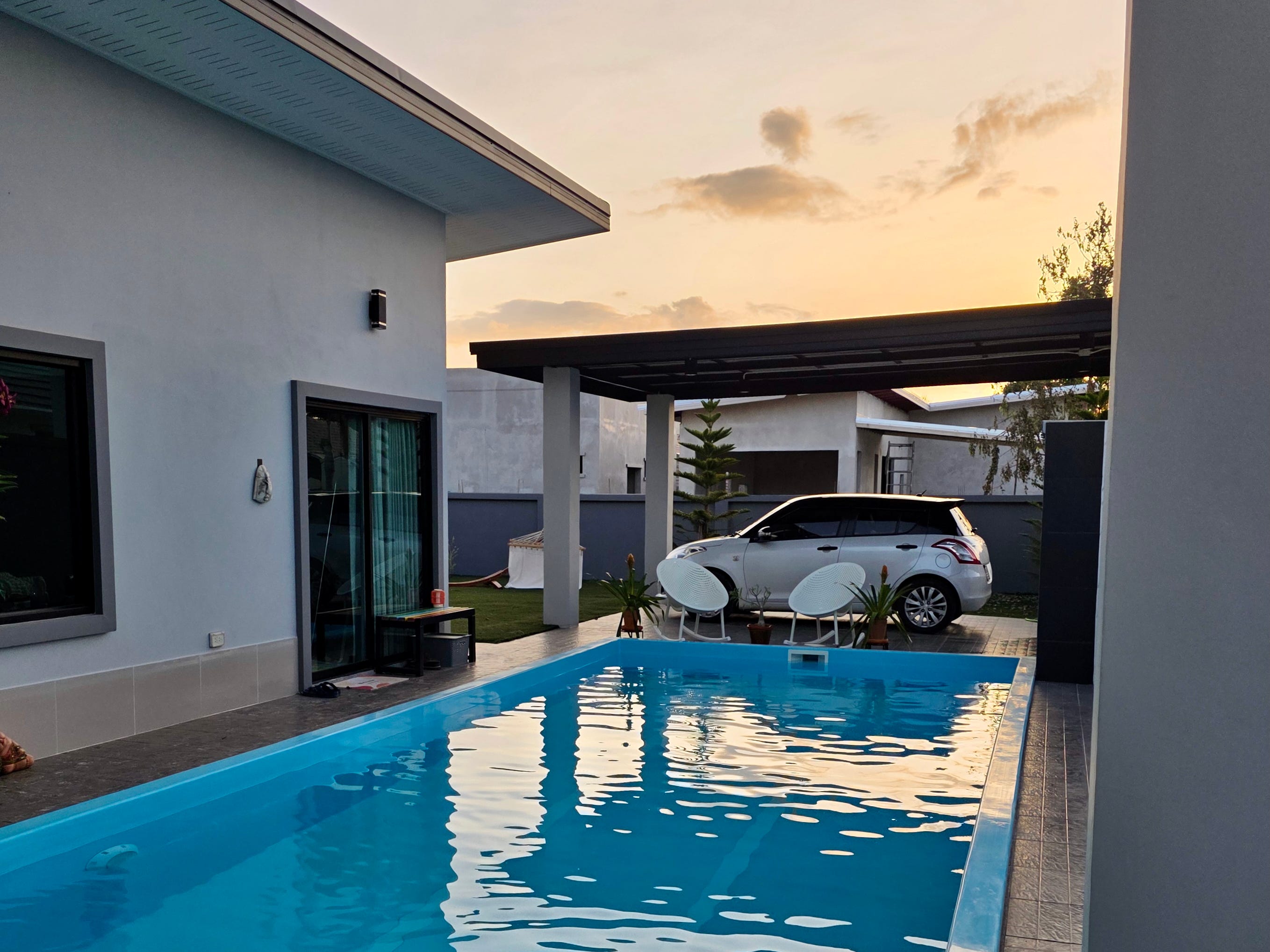 The pool and exterior of the house.