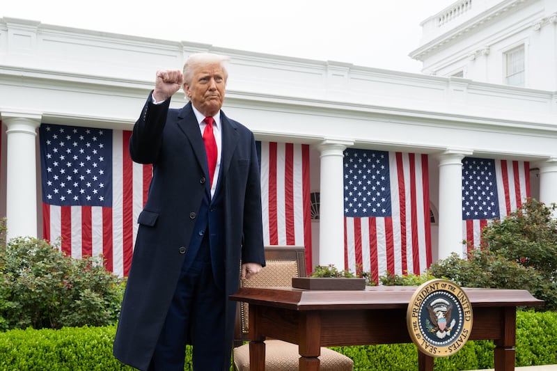 US President Donald Trump pumps his fist after signing an executive order after delivering remarks on reciprocal tariffs during an event in the Rose Garden entitled