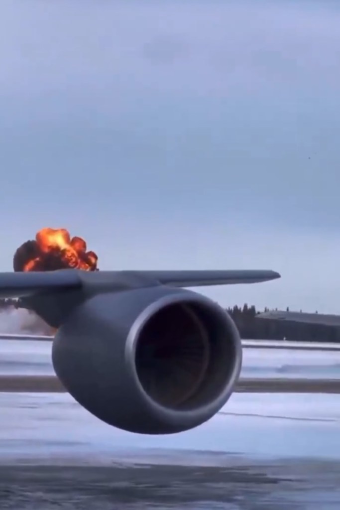A fighter jet crashing in flames.