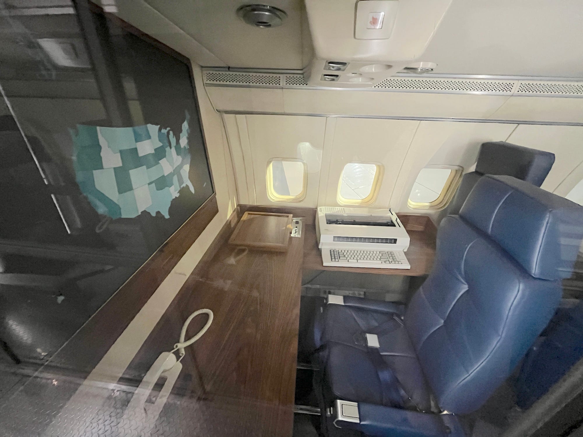 A conference room with a map of the United States aboard SAM 26000.