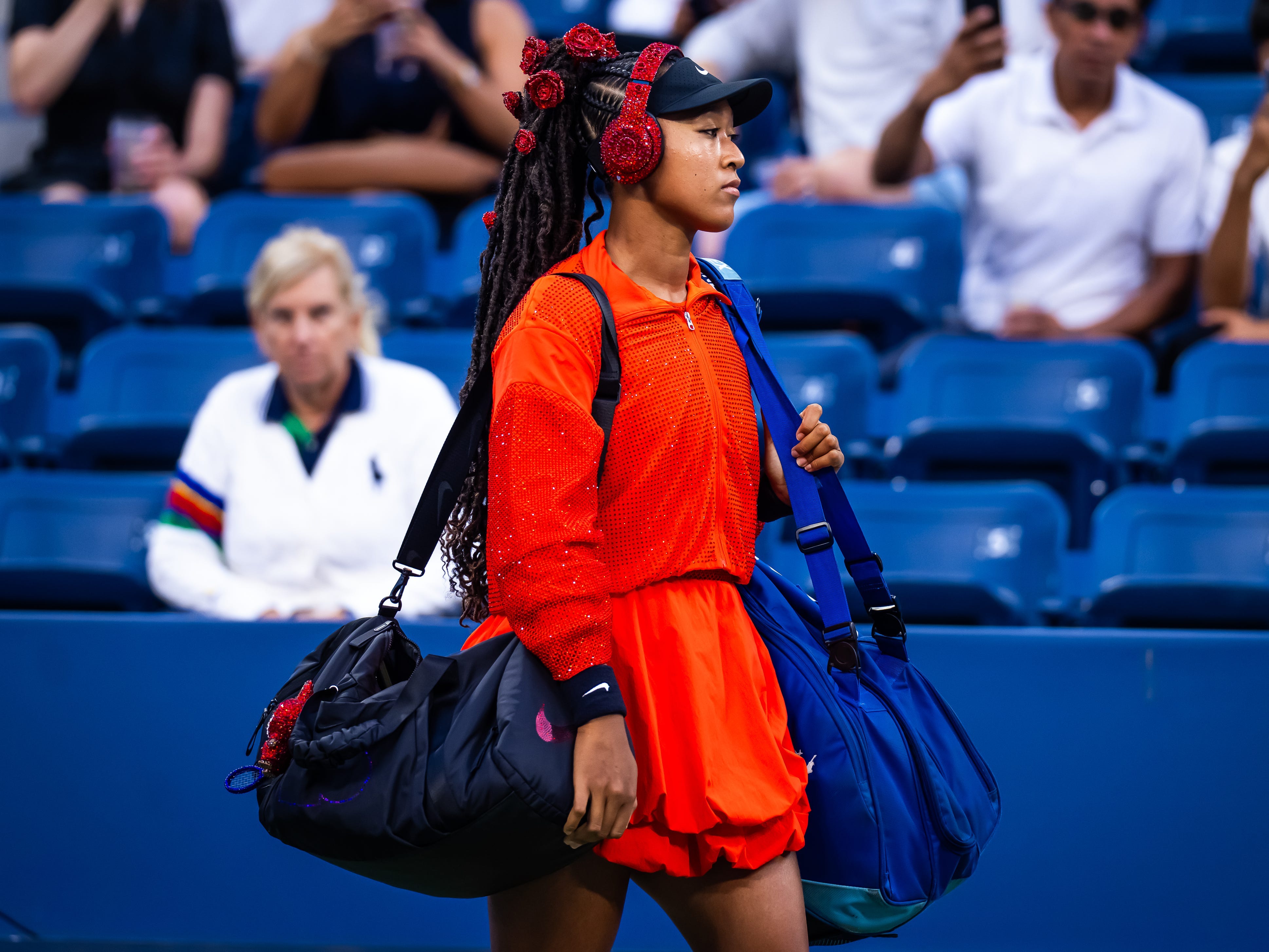 Naomi Osaka walks onto the court at the US Open.