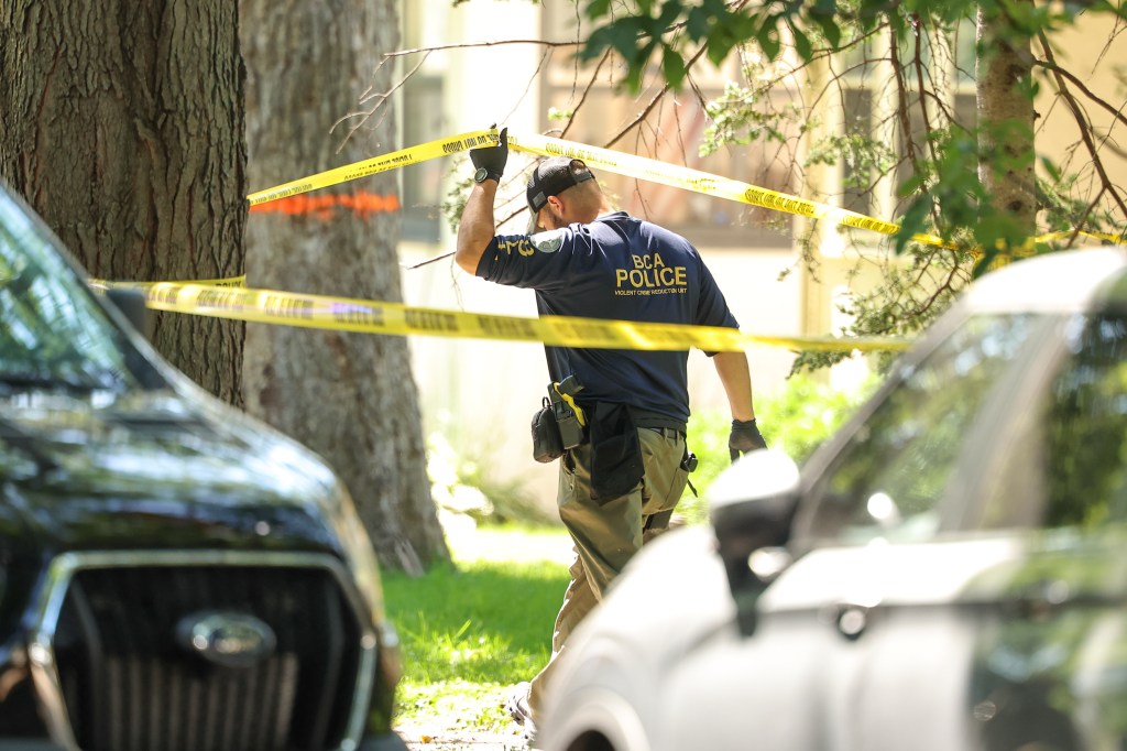 Police officer at the scene of a shooting.