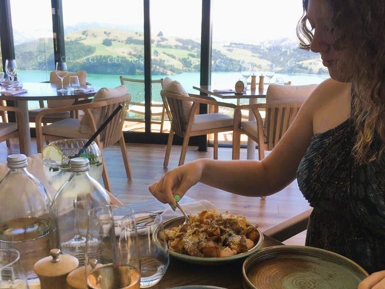 Teen eating lunch at restaurant.