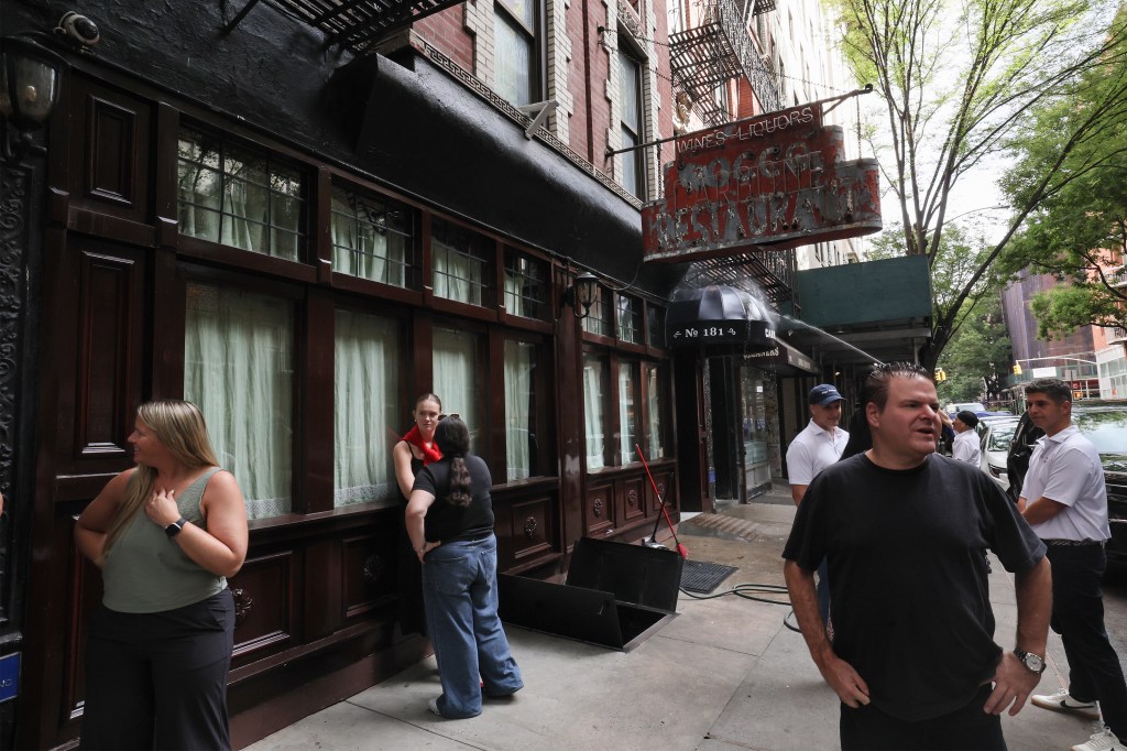 People standing outside Carbone restaurant.