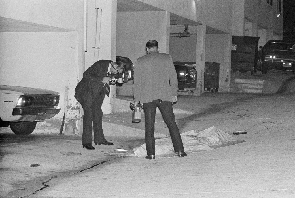 Crime scene investigators photograph the body of Sal Mineo.