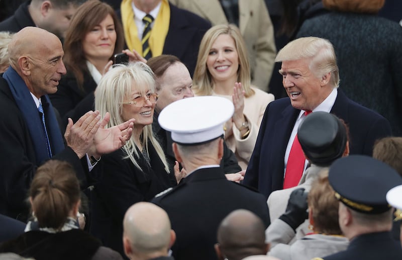 Tom Barrack, Miriam Adelson and Sheldon Adelson greet U.S. President-elect Donald Trump on the West Front of the U.S. Capitol on January 20, 2017 in Washington, DC. In today's inauguration ceremony Donald J. Trump becomes the 45th president of the United States. (Photo by Chip Somodevilla/Getty Images)