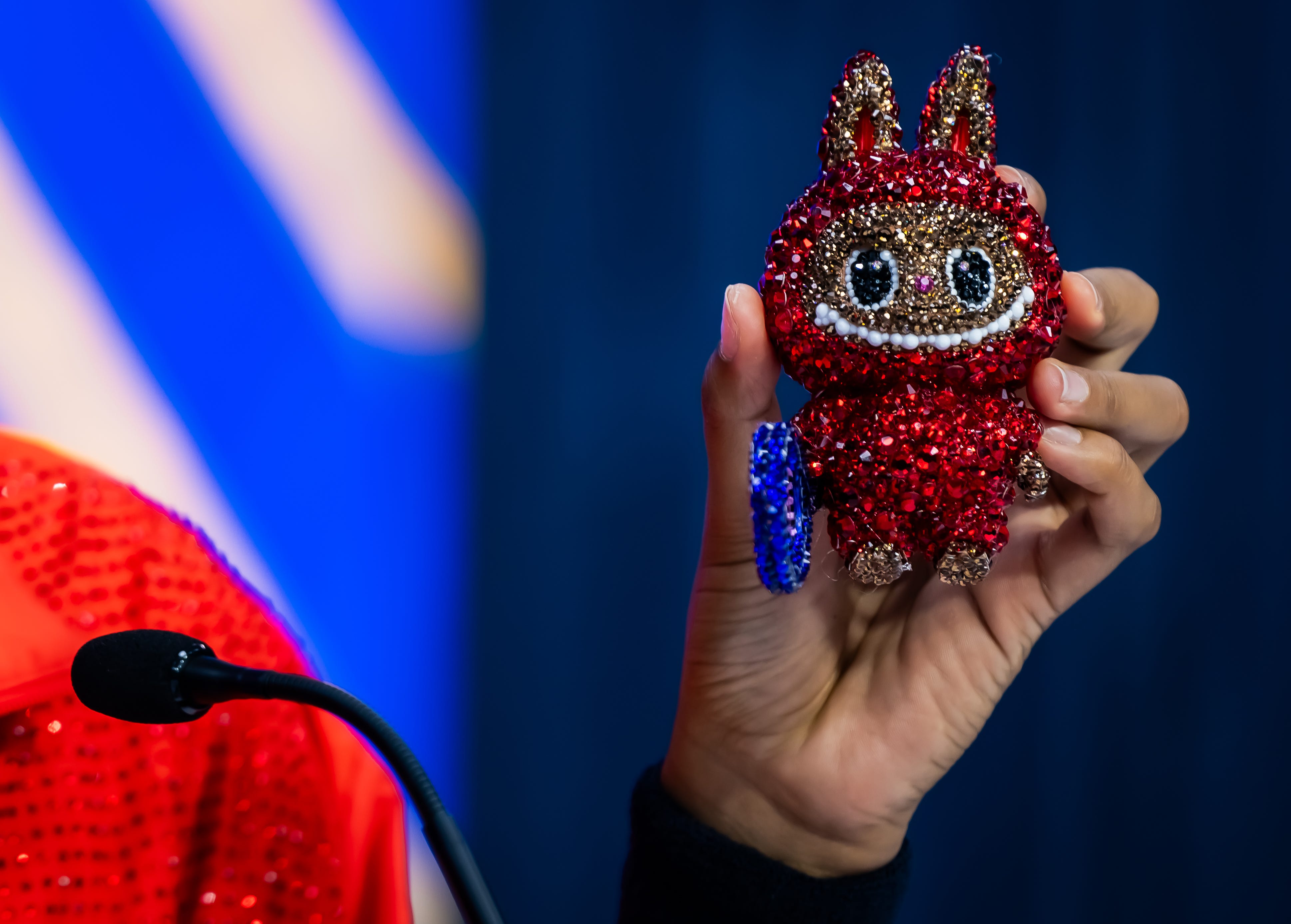 Osaka holding up her Labubu.