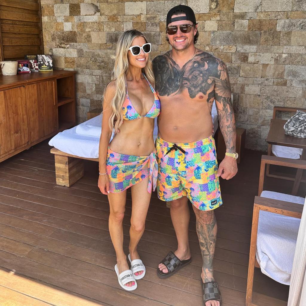 Christina Haack and Josh Hall pose together.