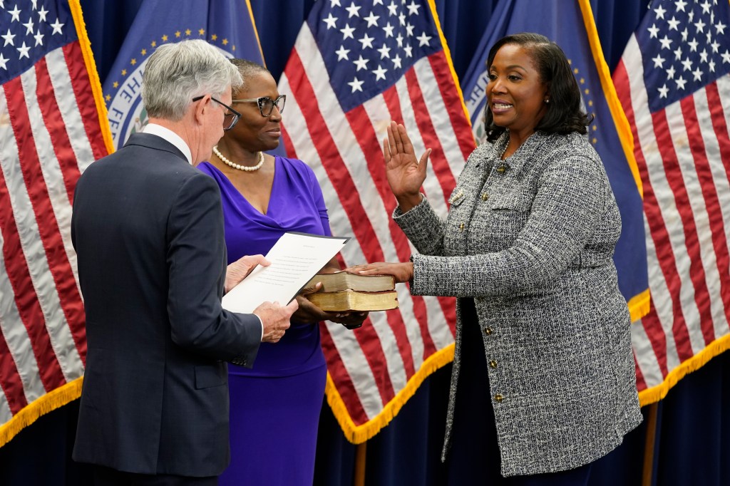 Lisa Cook takes the oath of office to become a member of the Federal Reserve Board by Jerome Powell on May 23, 2022.