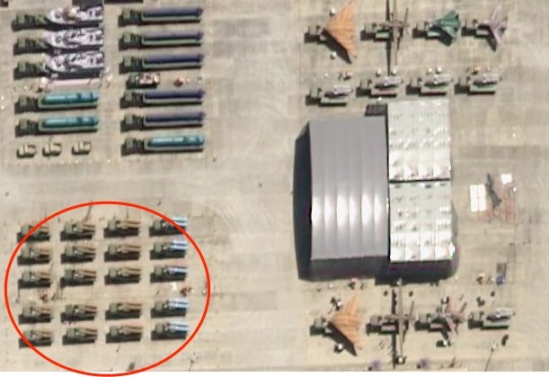 In an overhead shot, 20 trucks can be seen mounted with missile systems.
