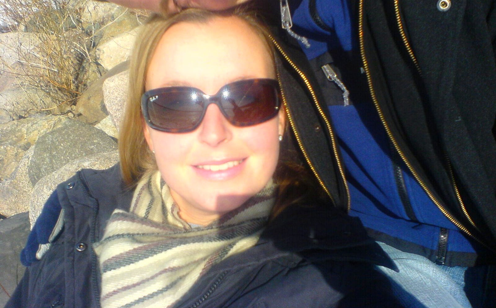 close up of a woman wearing sunglasses