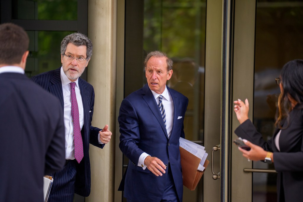Attorneys Norman Eisen and Abbe Lowell leaving a federal court hearing.