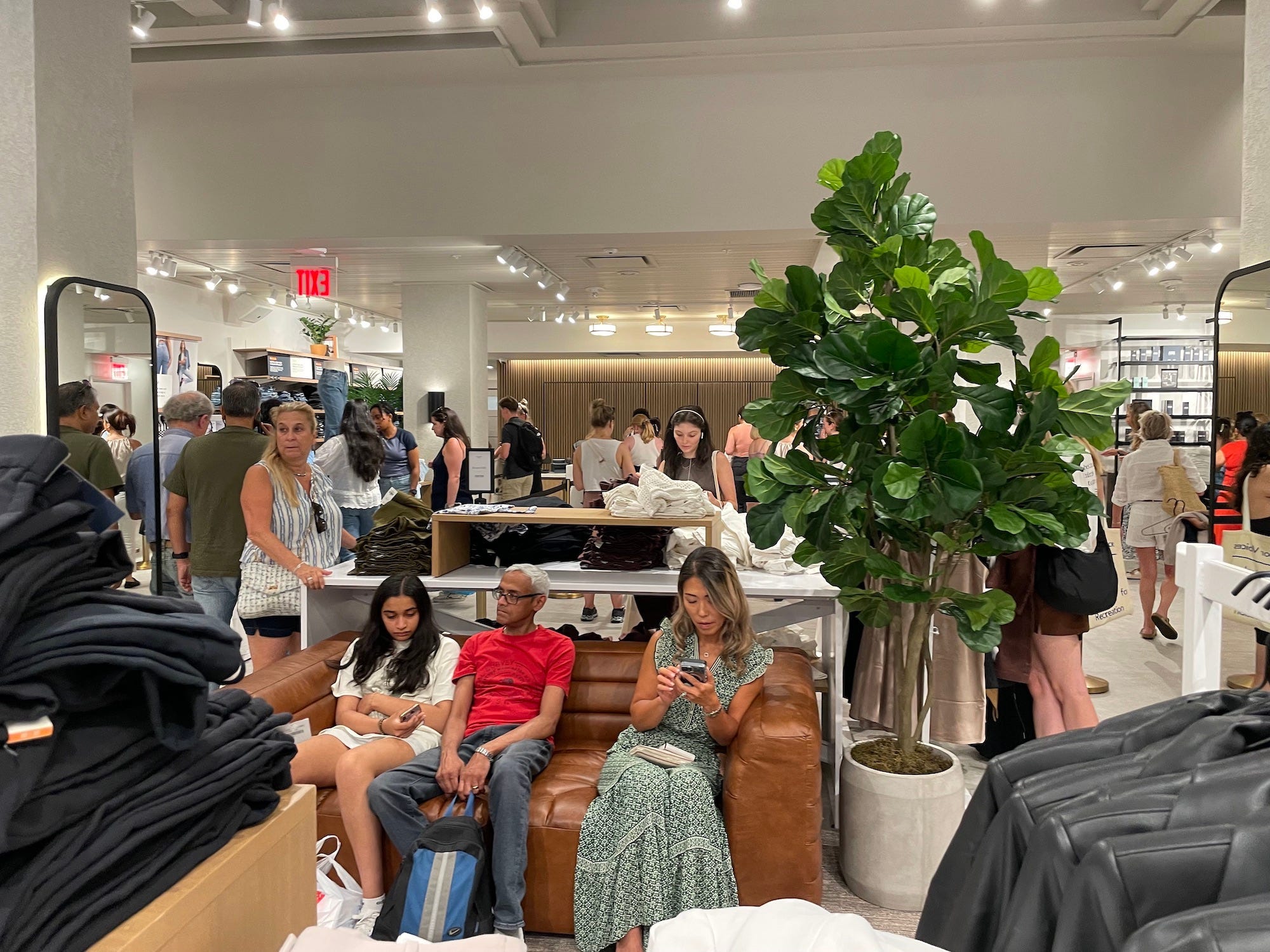 people sit on a couch inside abercrombie