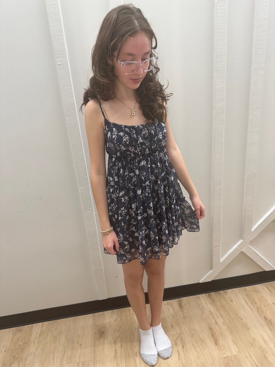 The author's daughter trying on clothes.