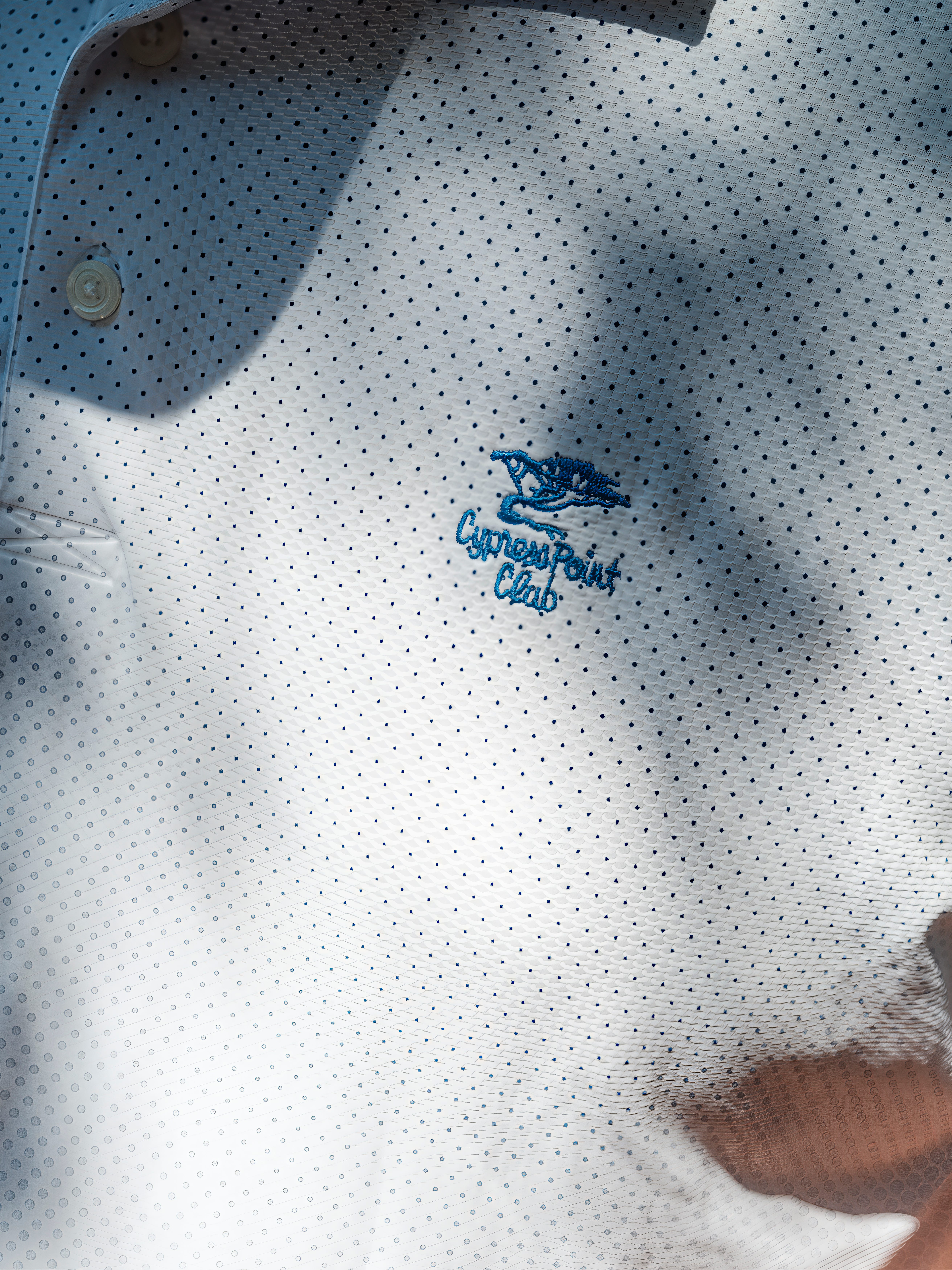 A close up of a golf polo