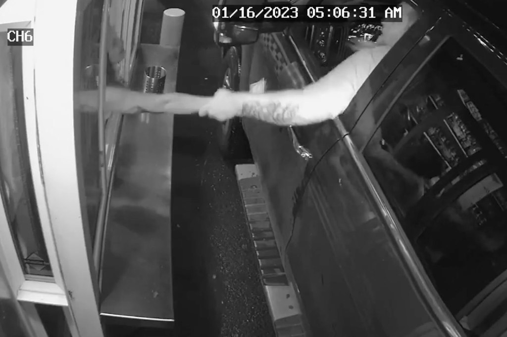 Security camera footage of attempted kidnapping at drive-through window.