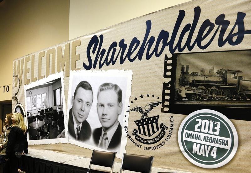 A billboard welcoming Berkshire Hathaway shareholders, displays a vintage picture of Chairman Warren Buffett (L) and Vice Chairman Charlie Munger, at the company's annual meeting in Omaha May 4, 2013. REUTERS/Rick Wilking