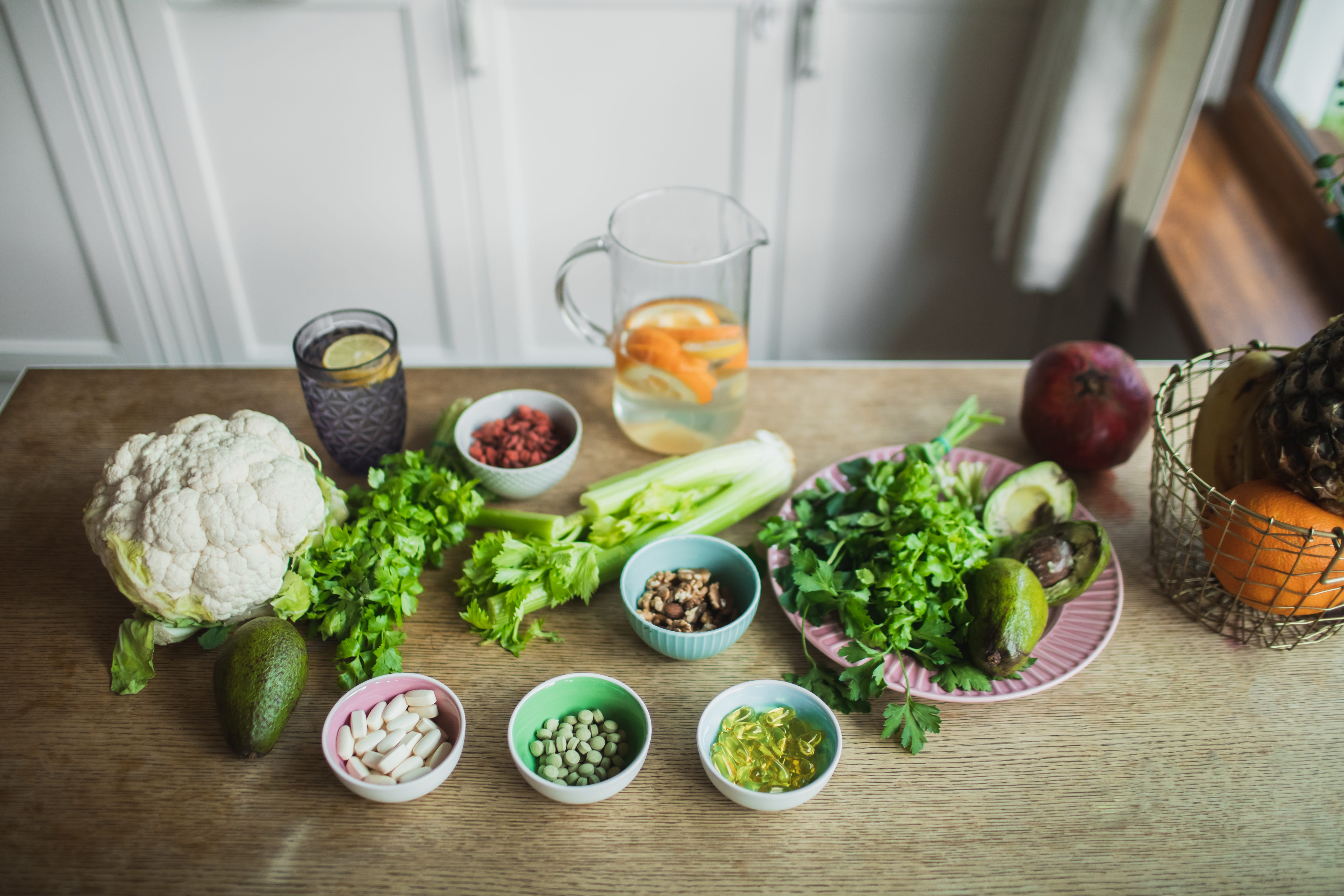 Some green vegetables on display in a kitchen counter.
