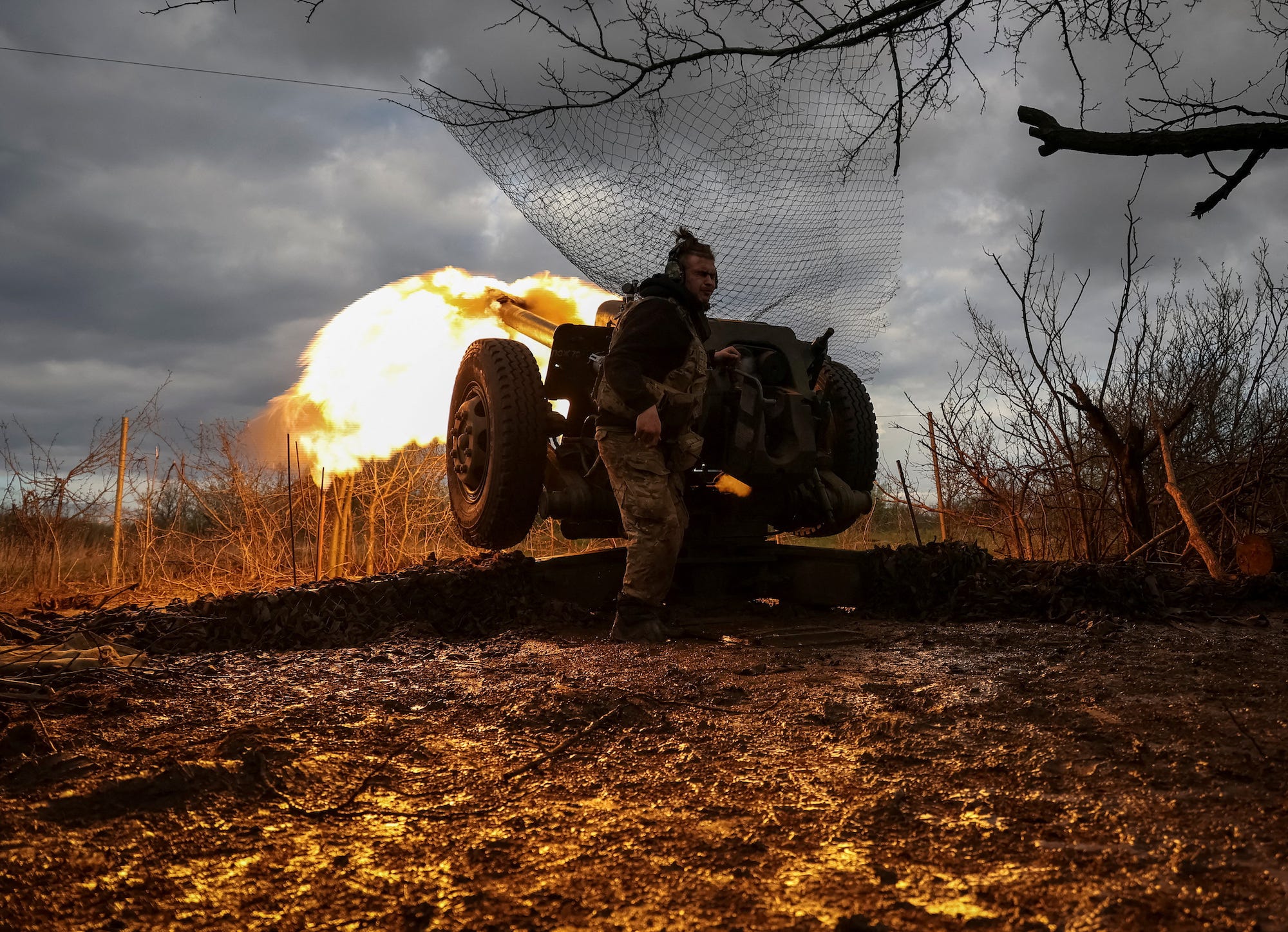 Ukrainian service members from a 3rd separate assault brigade of the Armed Forces of Ukraine, fire a howitzer D30 at a front line, amid Russia's attack on Ukraine, near the city of Bakhmut, Ukraine April 23, 2023.