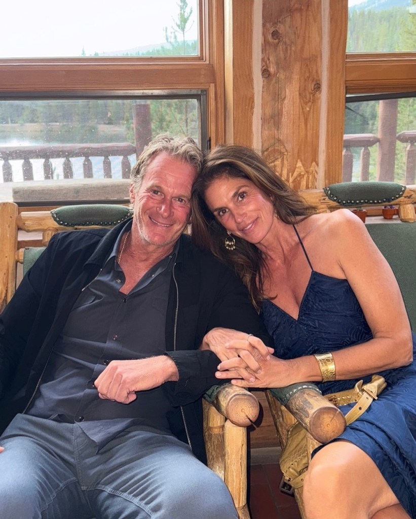 Rande Gerber and Cindy Crawford pose on a summer road trip for a family wedding.
