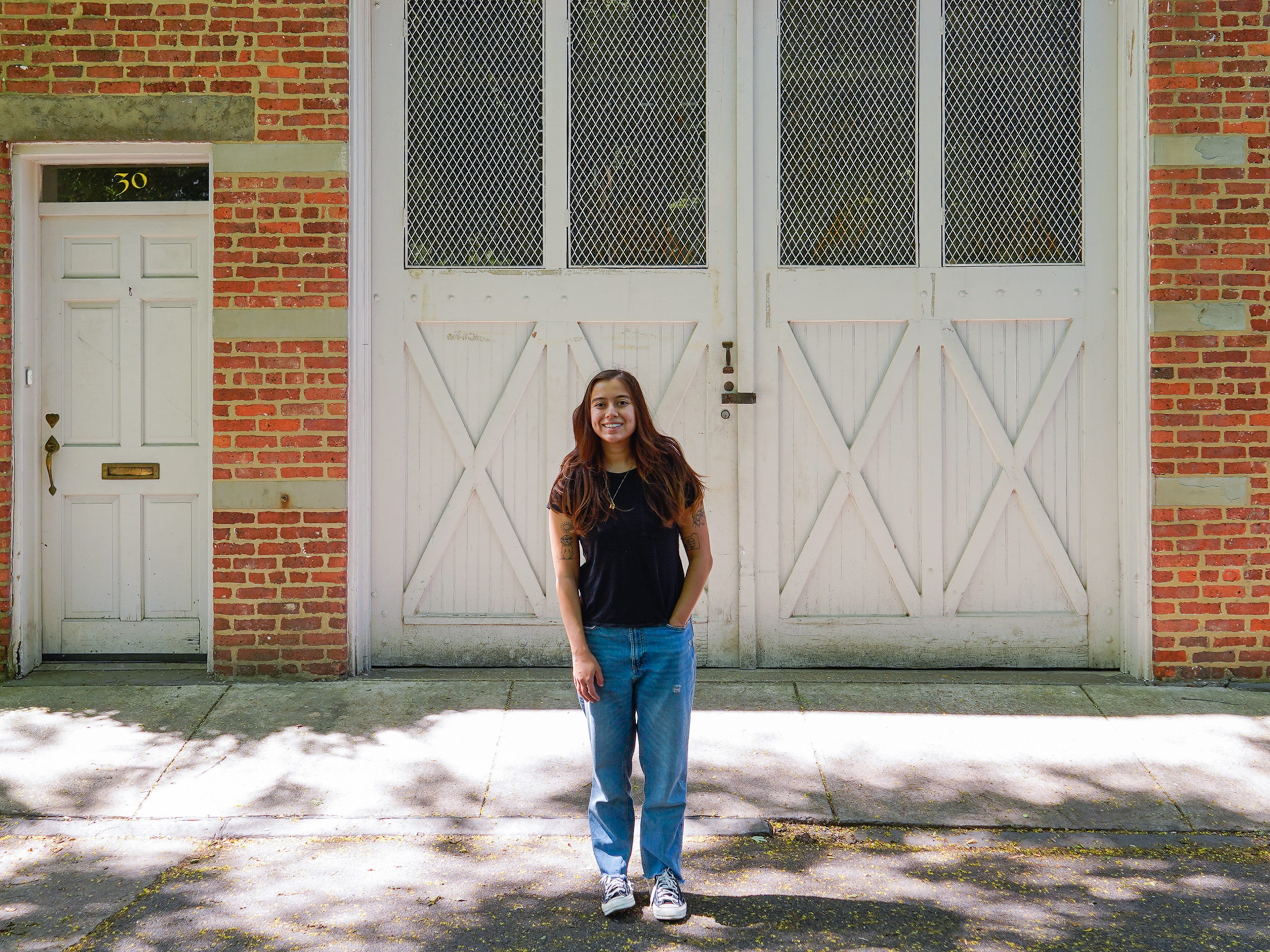 The author stands in front of residential mews in NYC