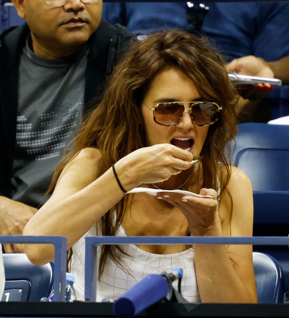 Katie Holmes eating chicken and caviar at the US Open