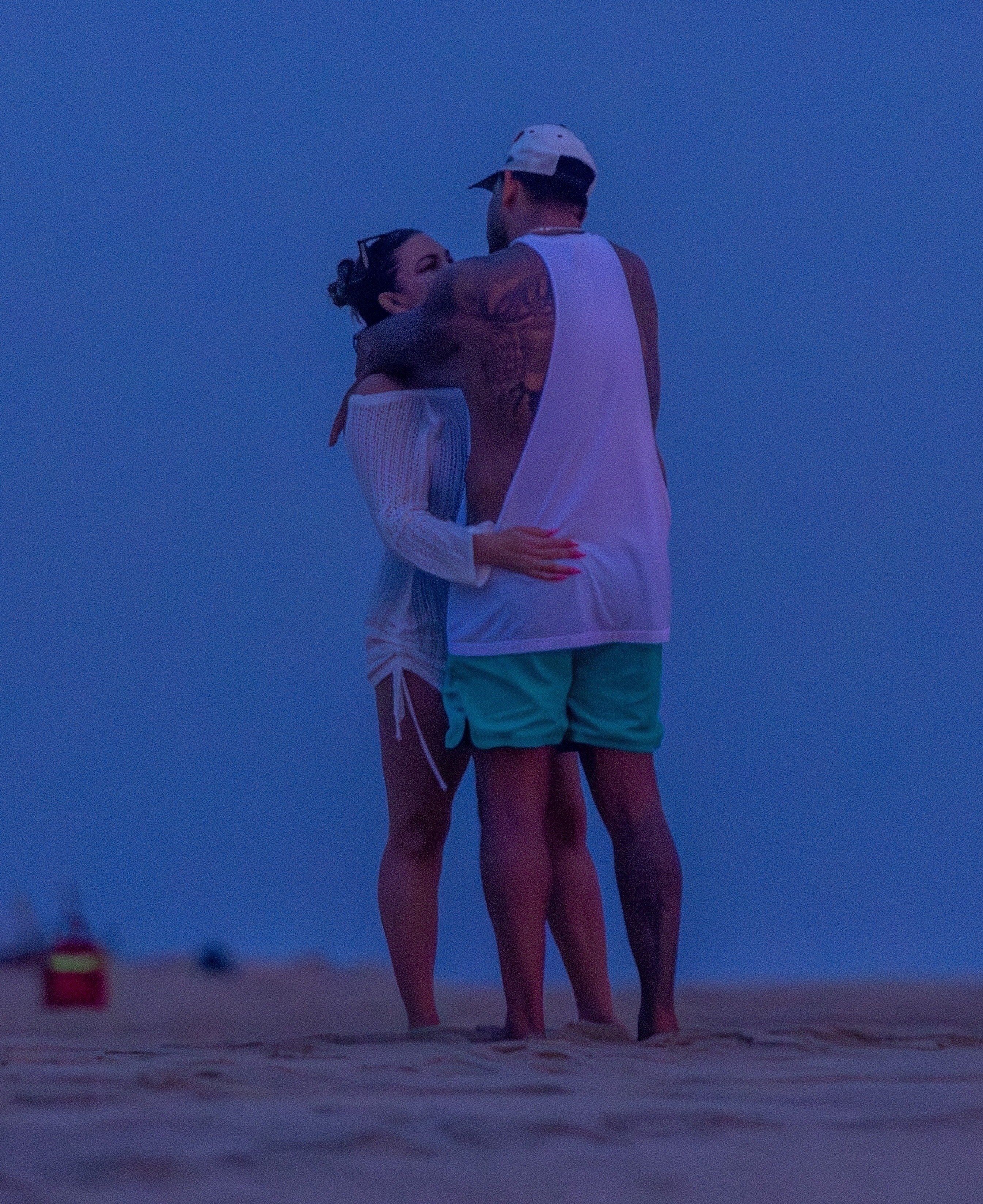 Brittany Cartwright and Brandon Hanson hug on the beach. 