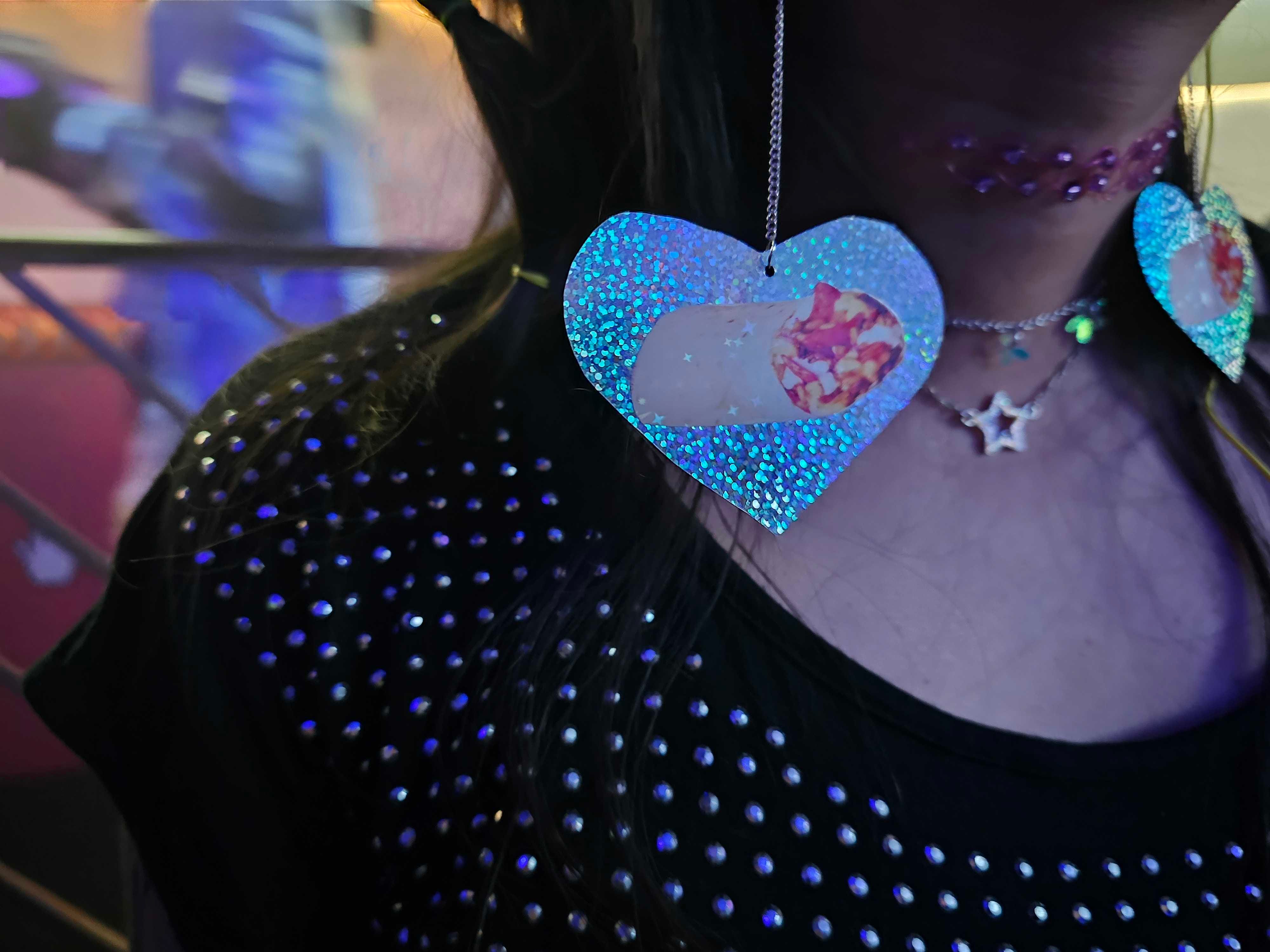 A Taco Bell fan wearing a pair of earrings featuring her favorite burrito.
