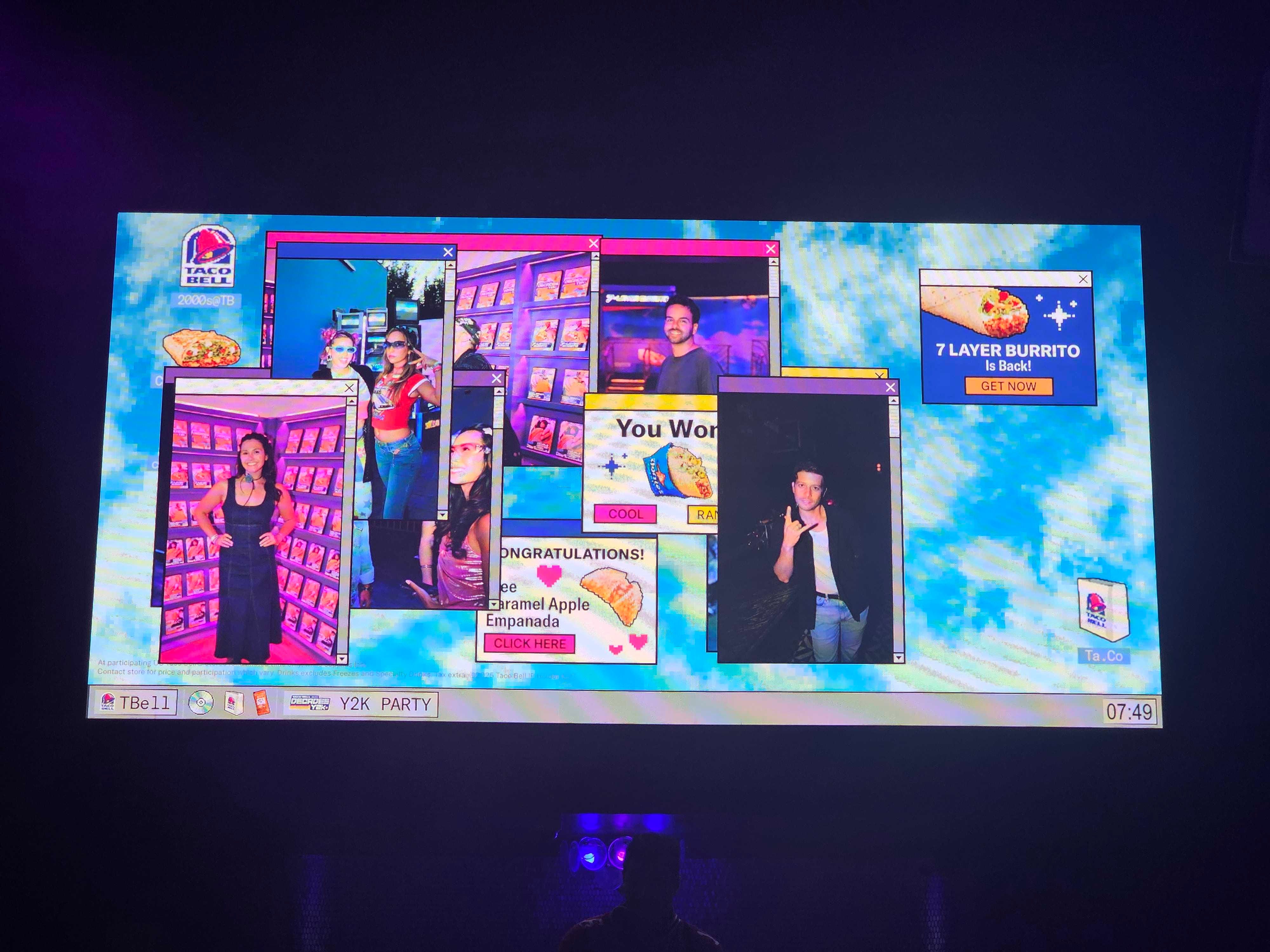 The head of a DJ is illuminated by a projector screen displaying Taco Bell fan imagery.