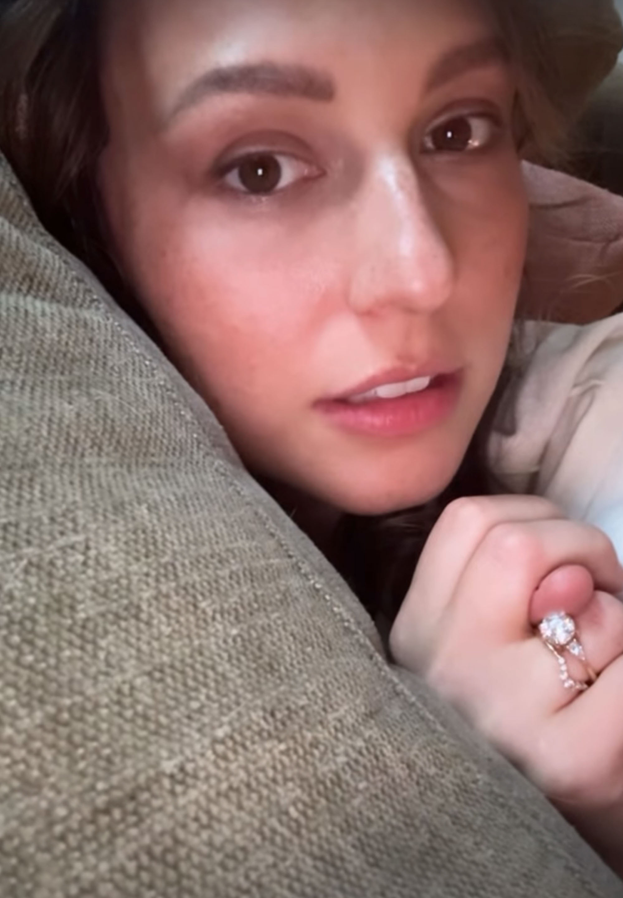 Katie Thurston on a couch. 