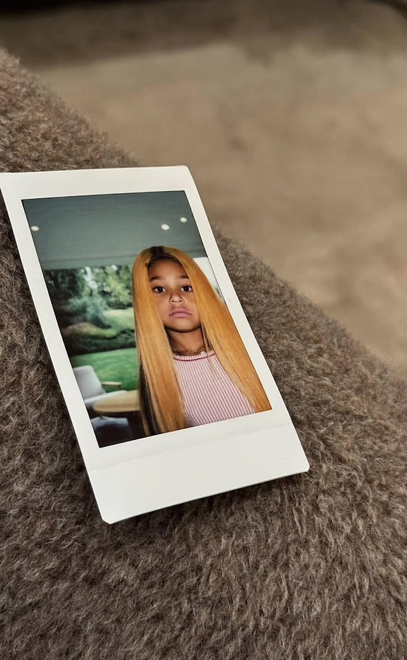 Stormi Webster in an orange wig. 
