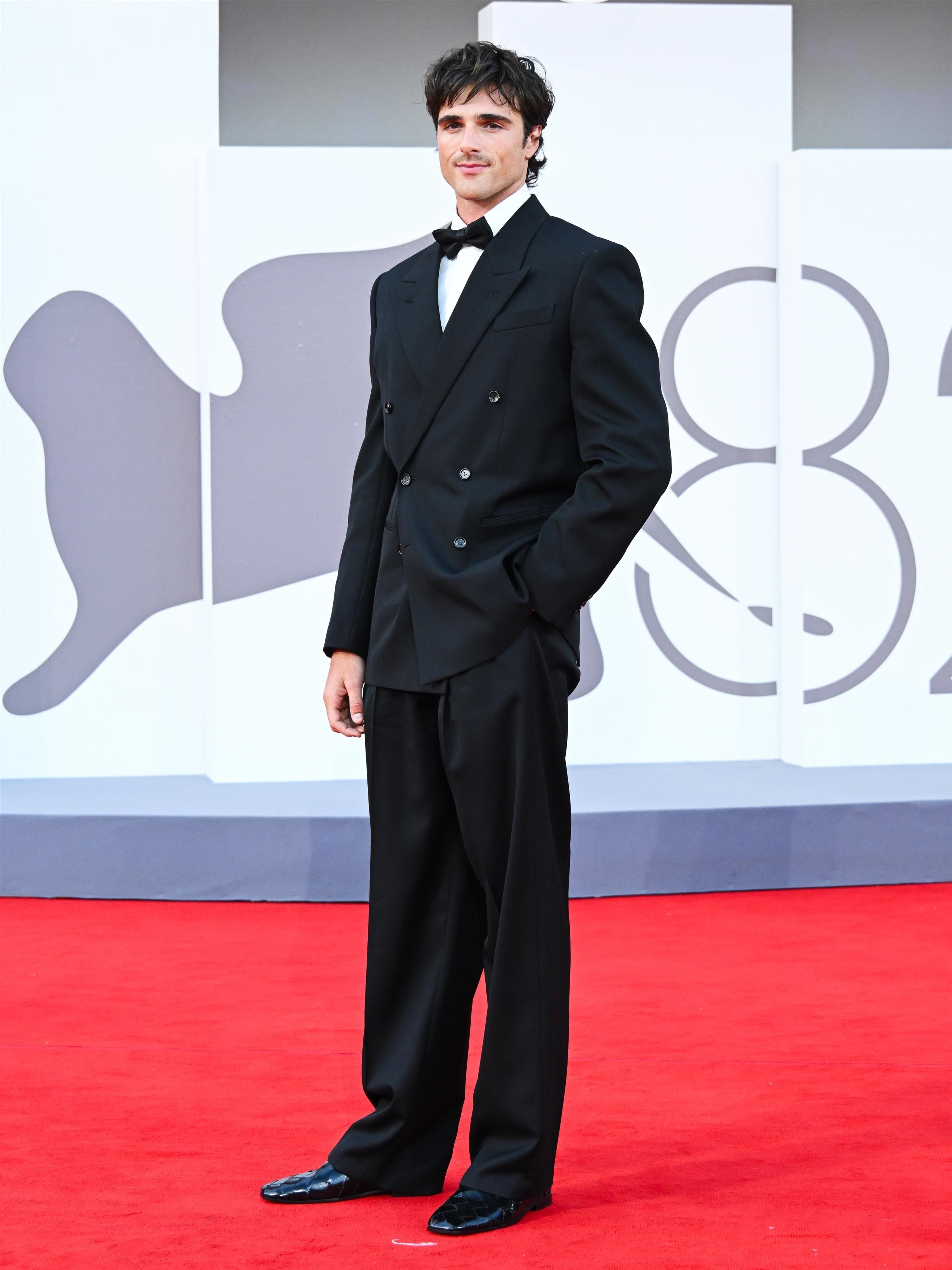 Jacob Elordi poses in a tuxedo at the Venice Film Festival. 