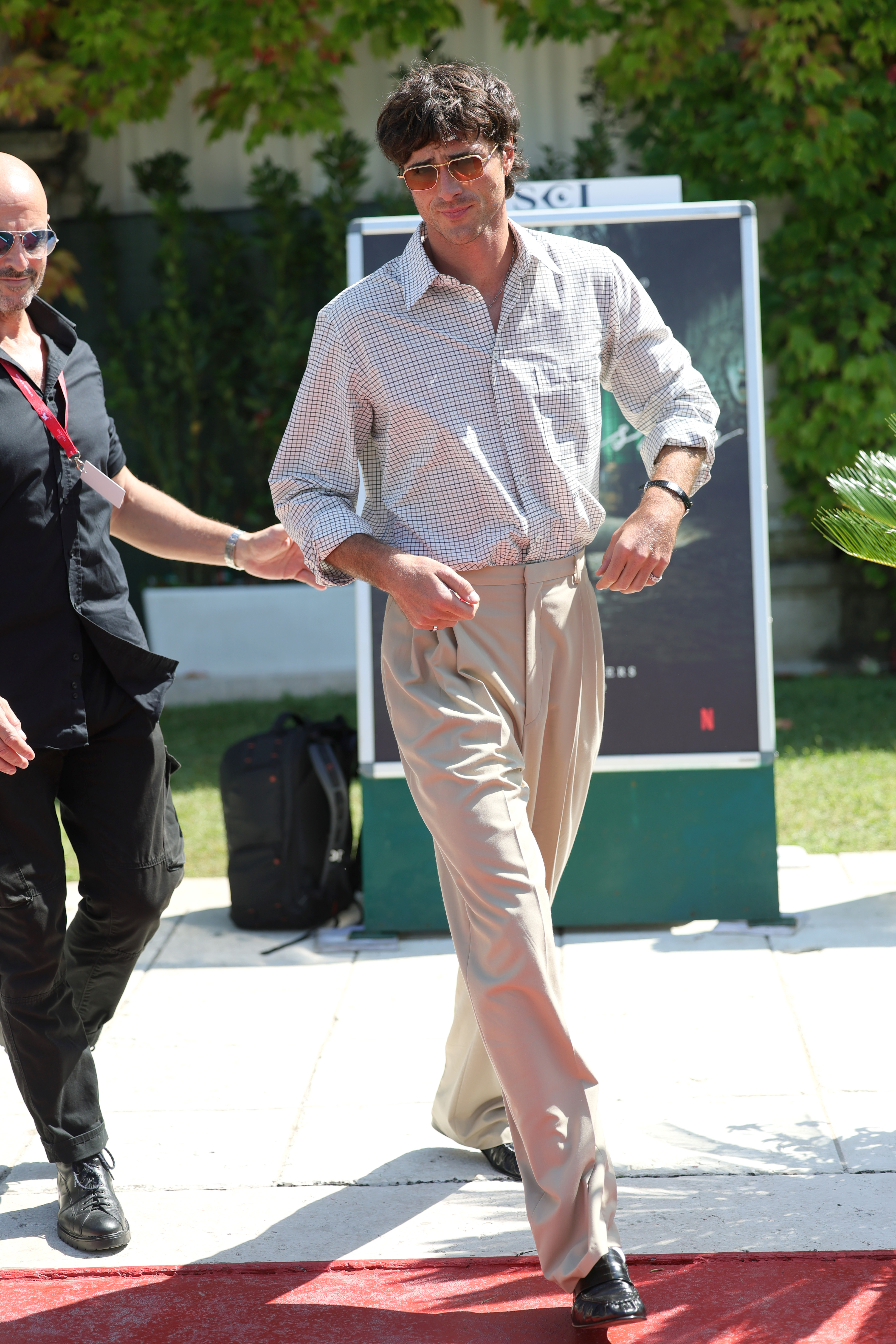 Jacob Elordi walking outdoors. 