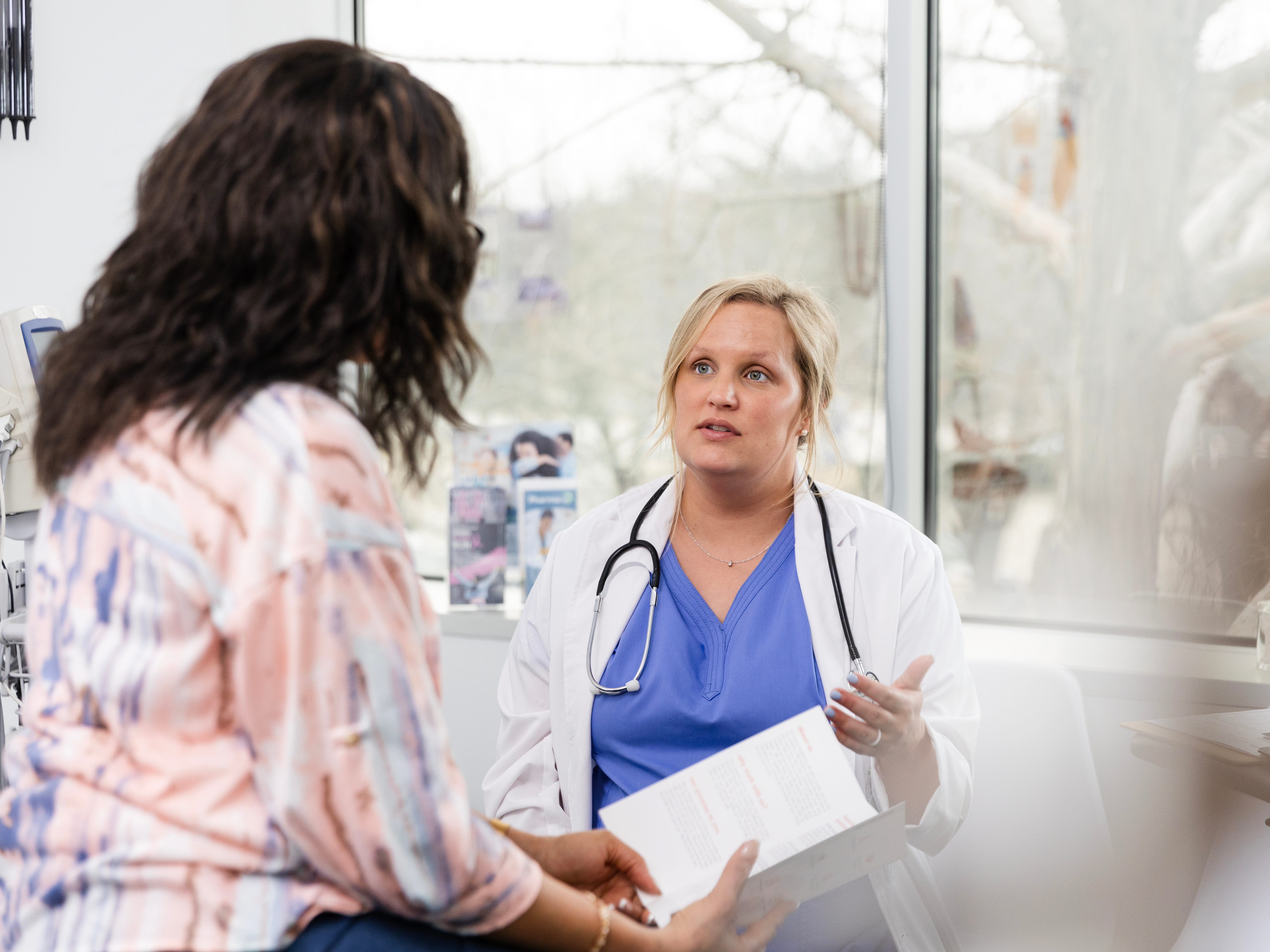 Healthcare worker or doctor with a patient