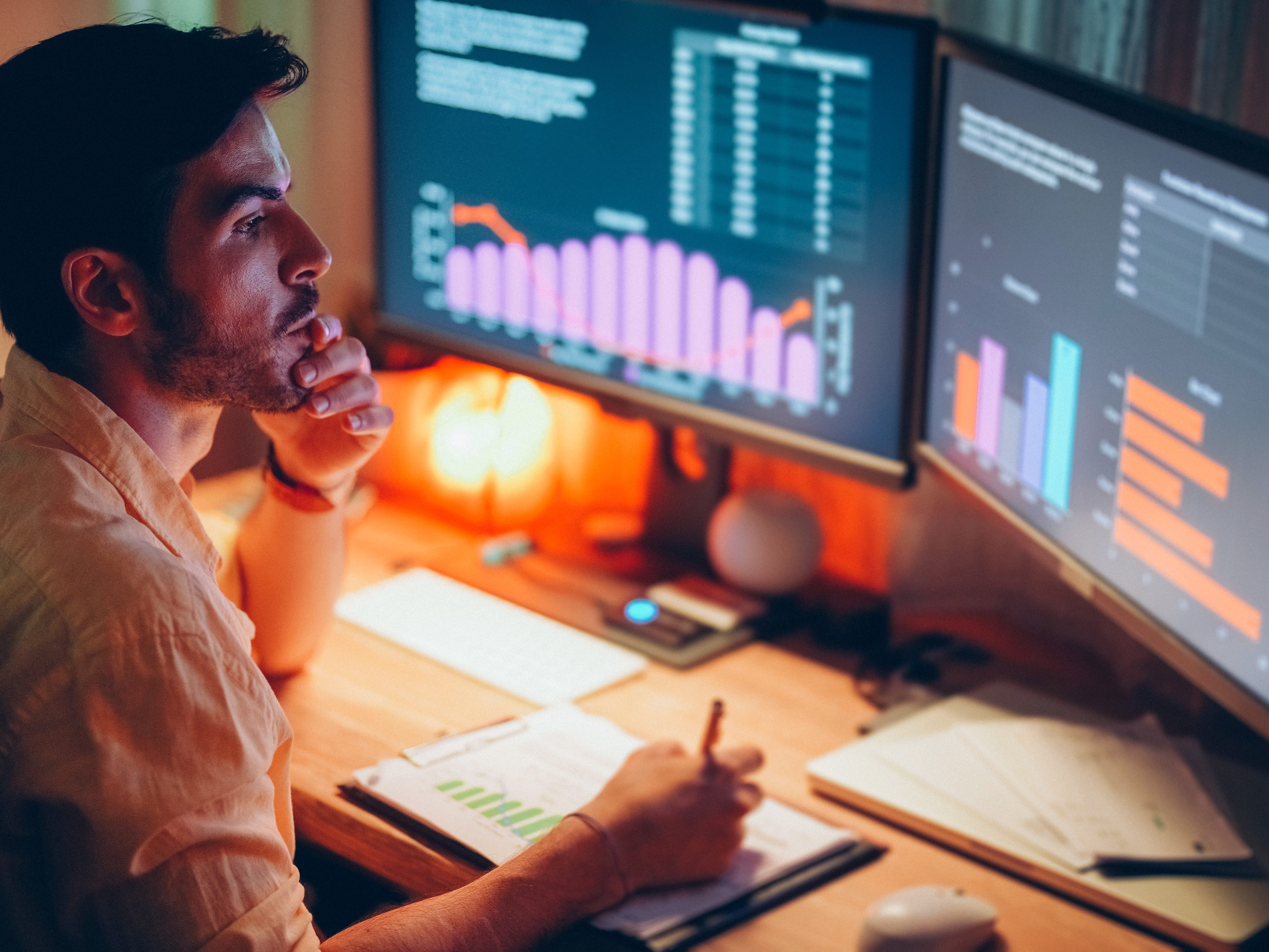 Person looking at data graphics on a computer screen
