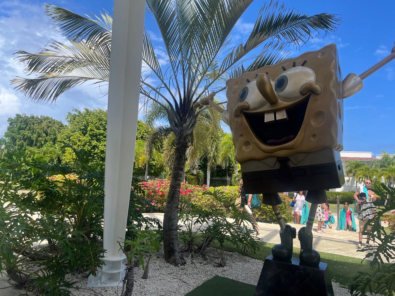 Spongebob statue next to palm tree