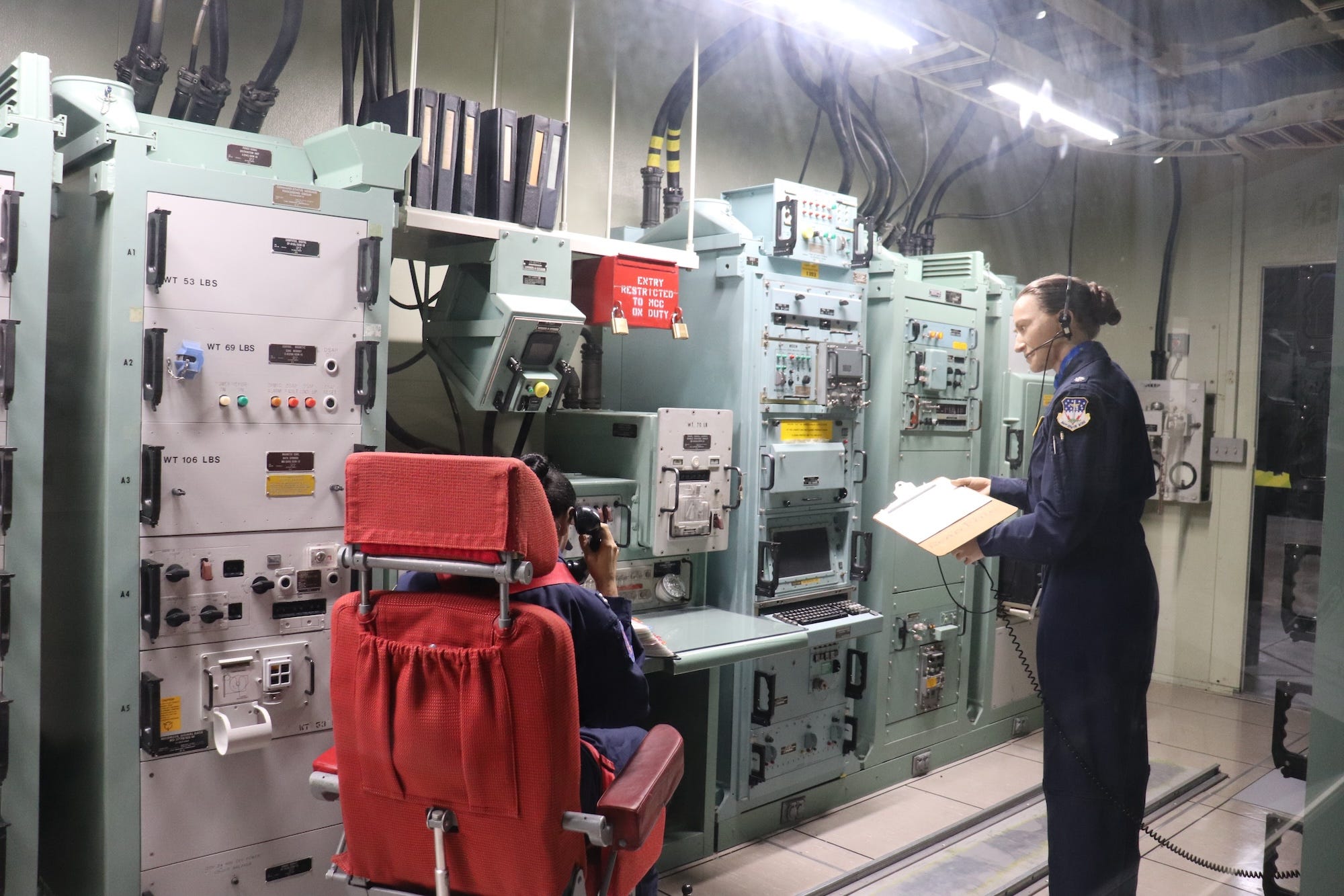 Museum mannequins inside the Minuteman II missile procedures trainer at the National Museum of the US Air Force.